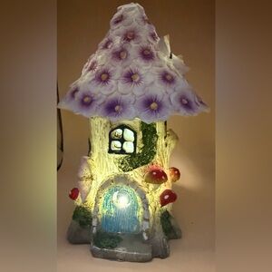 Whimsical Fairy House with Purple Floral Roof